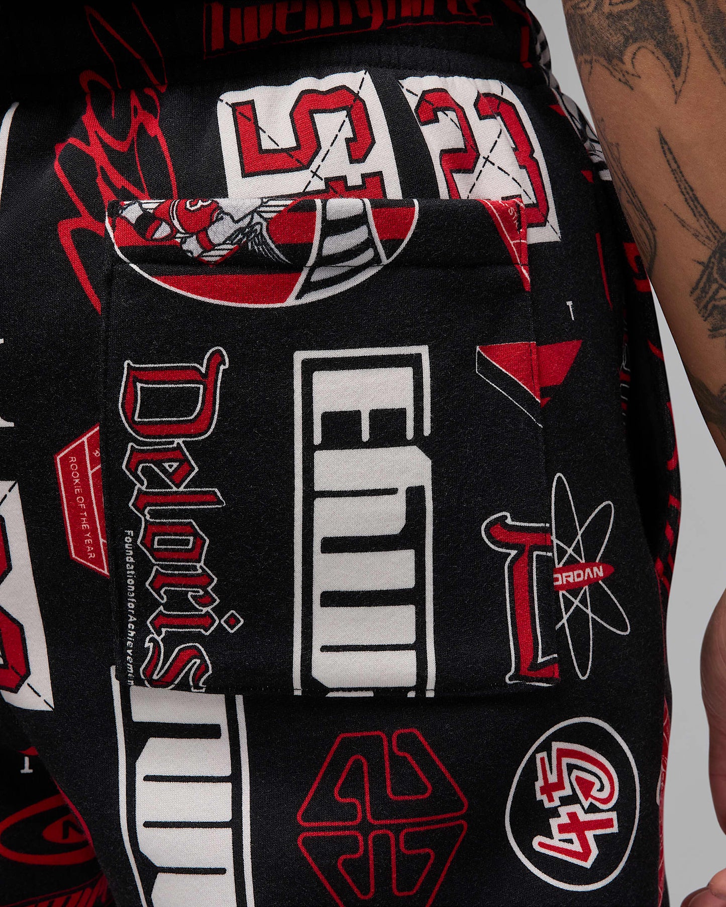 Nike Men's Jordan Essentials Printed Fleece Pants Apparel - Black / Varsity Red
