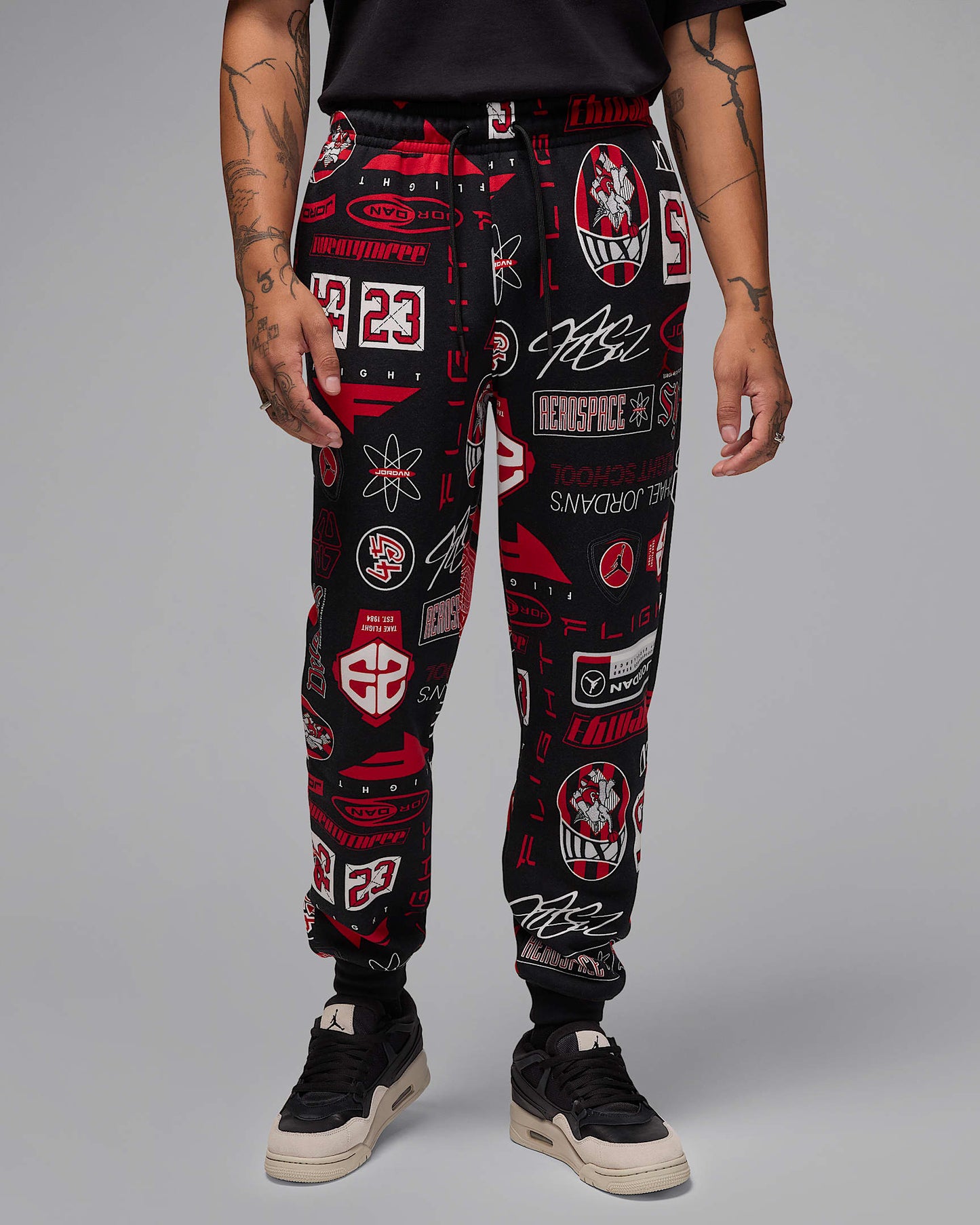 Nike Men's Jordan Essentials Printed Fleece Pants Apparel - Black / Varsity Red